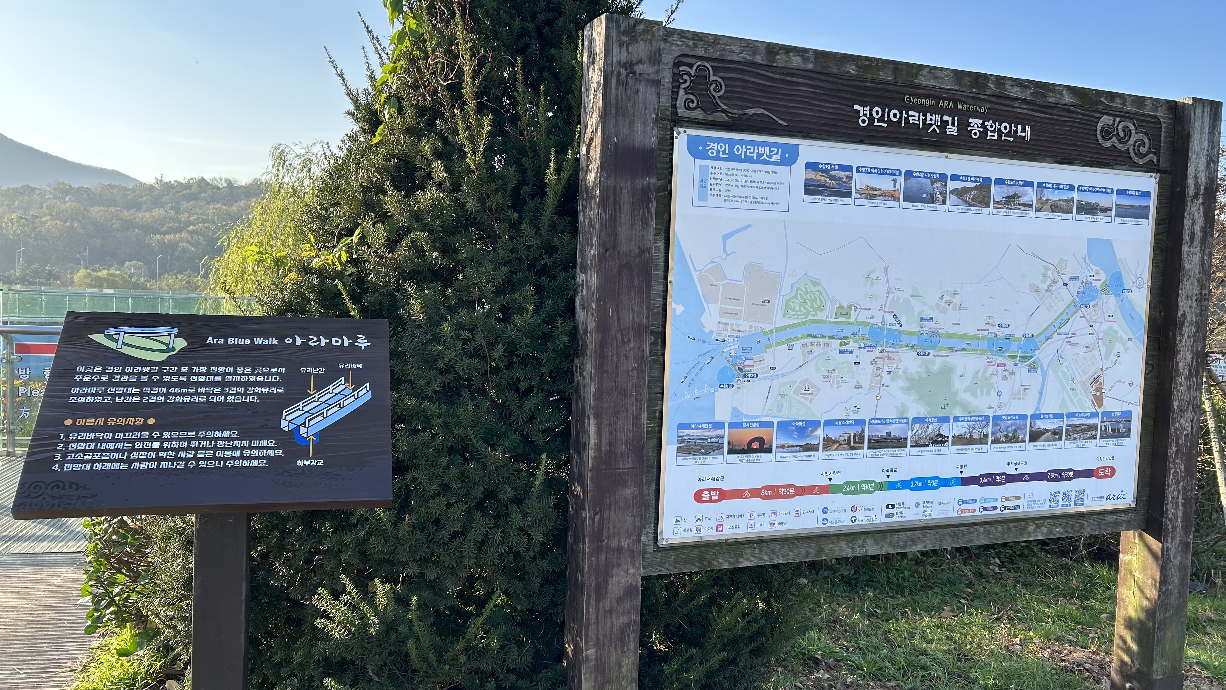 高处全景远眺，将「玻璃—瀑布—航道—峡谷」四层地景收进一帧。